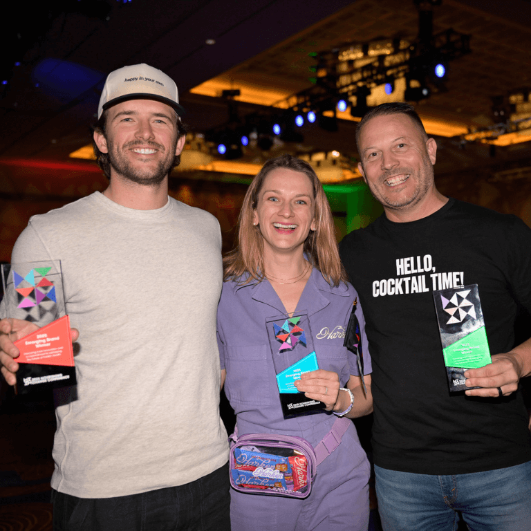ft-about@2x The 2025 Nourishing Change Emerging Brand Winners holding their awards with smiling faces