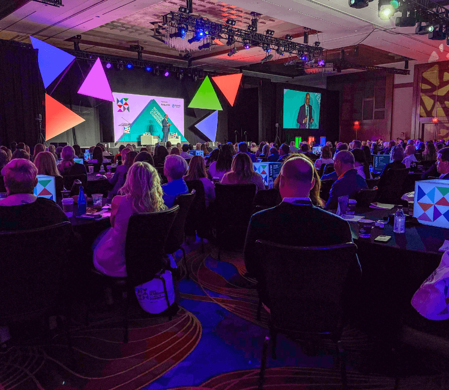 ft-what-its-about@2x Photo of the mainstage and audience from the 2025 Nourishing Change Conference